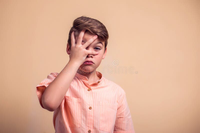 Scared Young Boy with Hands on His Face Stock Photo - Image of