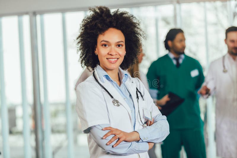 African american female doctor on hospital looking at camera smiling