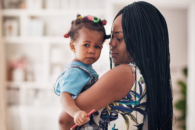 Portrait of african american mother and toddler baby girl at home