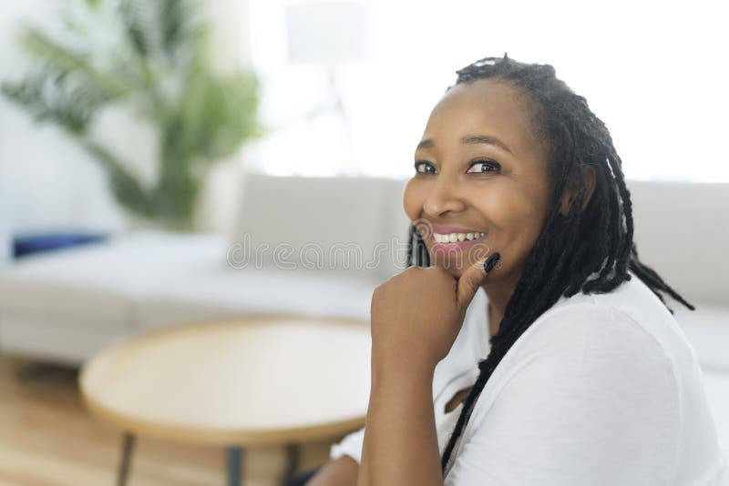 Portrait of an African Woman Sit on the Sofa Stock Photo - Image of ...