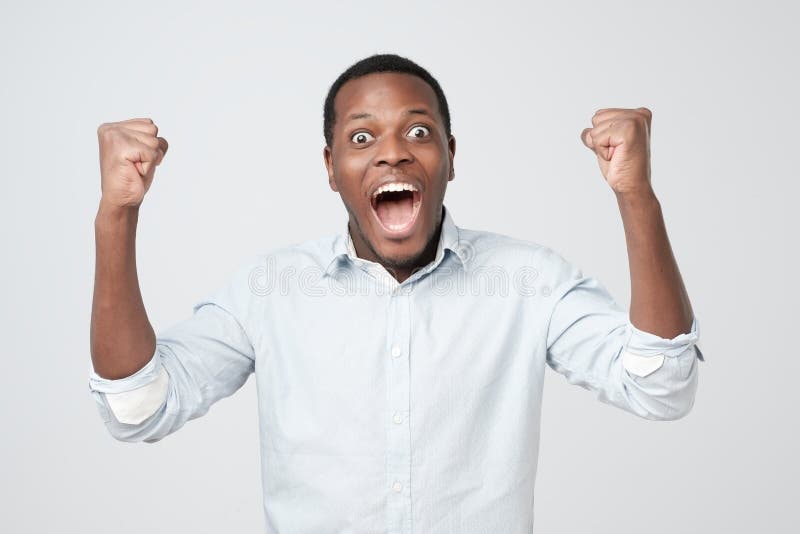 Portrait of african young handsome man surprised with news he got. royalty free stock images Portrait of african young handsome man surprised with news he got. royalty free stock images