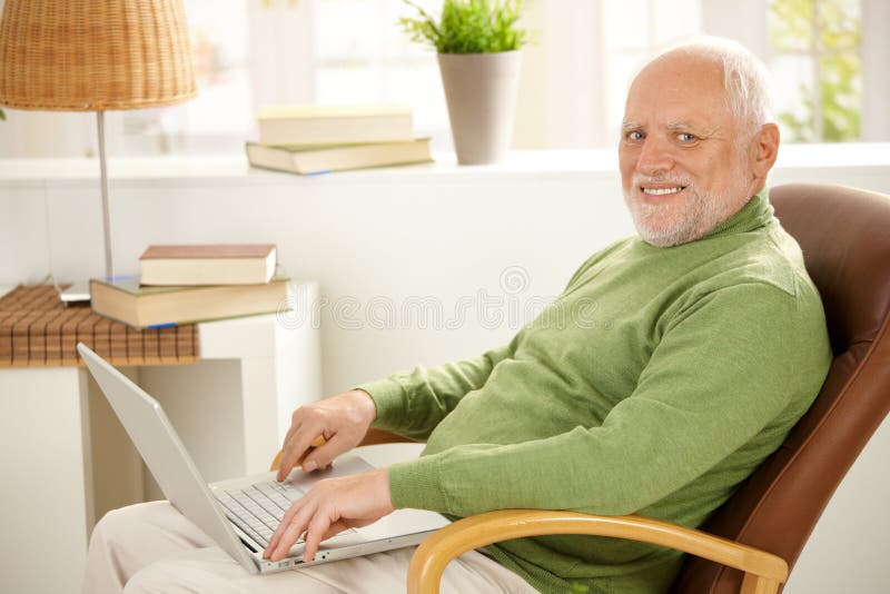 Portrait of aged man with laptop stock image Portrait of aged man with laptop stock image