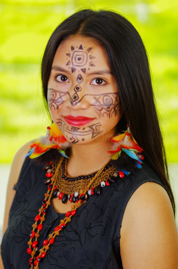 Amazonian Exotic Woman with Facial Paint and Black Dress, Natural Bag ...