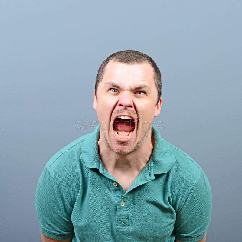 Portrait Of Angry Man Screaming Against Red Background Stock Image