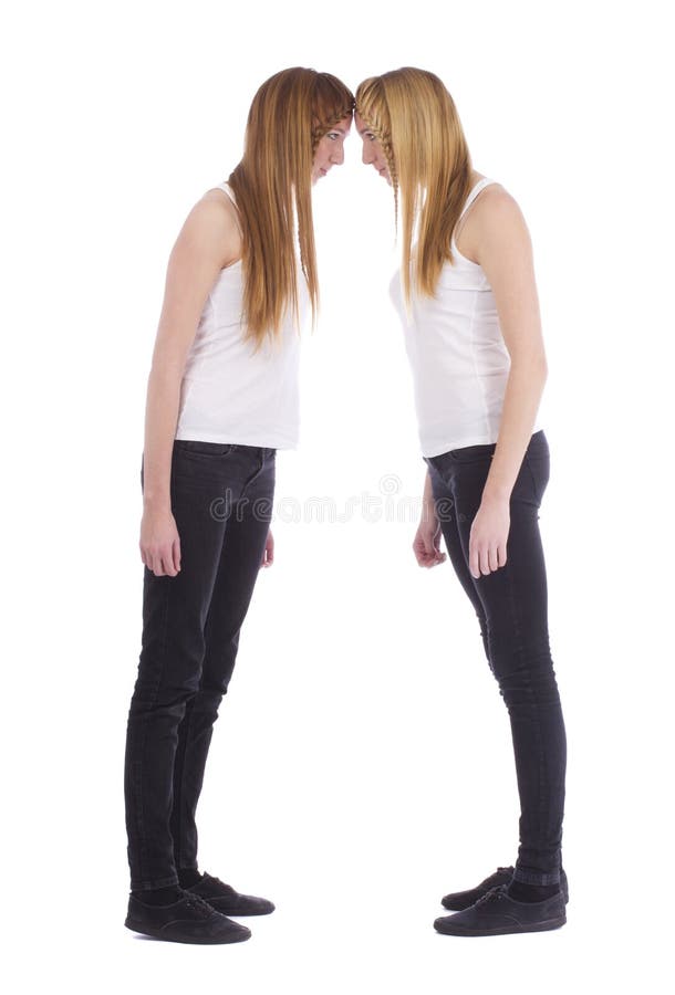 Portrait of the angry young twins sisters royalty free stock photo Portrait of the angry young twins sisters royalty free stock photo