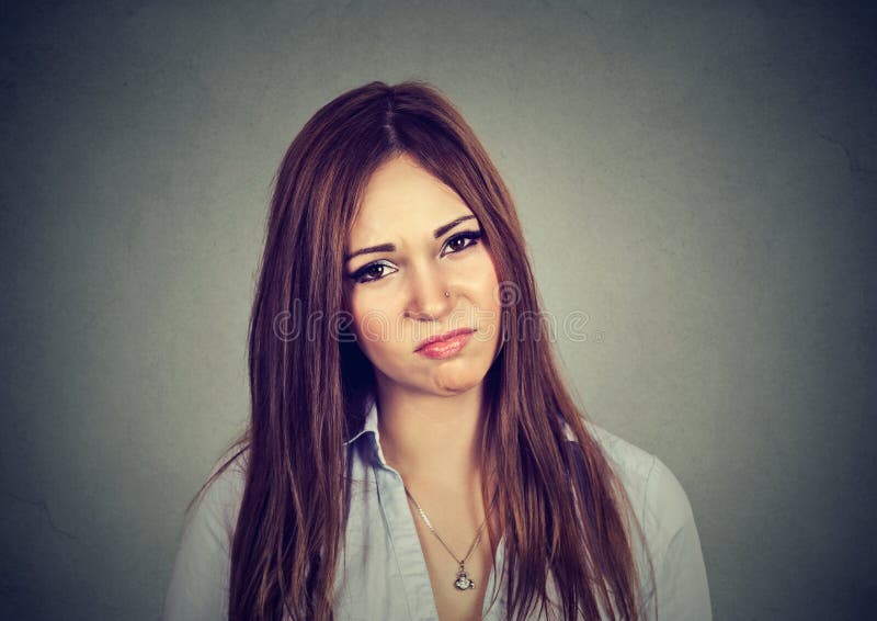 Portrait of annoyed irritated young woman on gray background. Portrait of annoyed irritated young woman on gray background