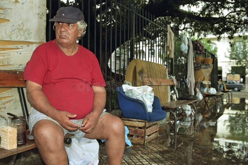 Portrait of Argentinian homeless old sad man