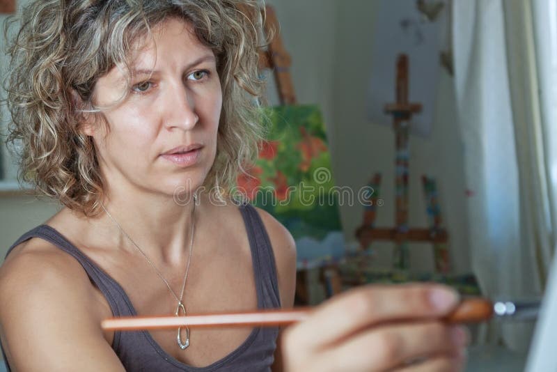 Portrait of the artist who paints. Women 30 years.