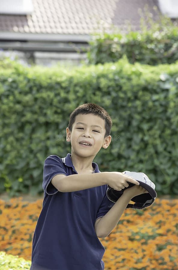 Portrait of Asean boy , laughing and smiling happily in the park stock photos Portrait of Asean boy , laughing and smiling happily in the park stock photos