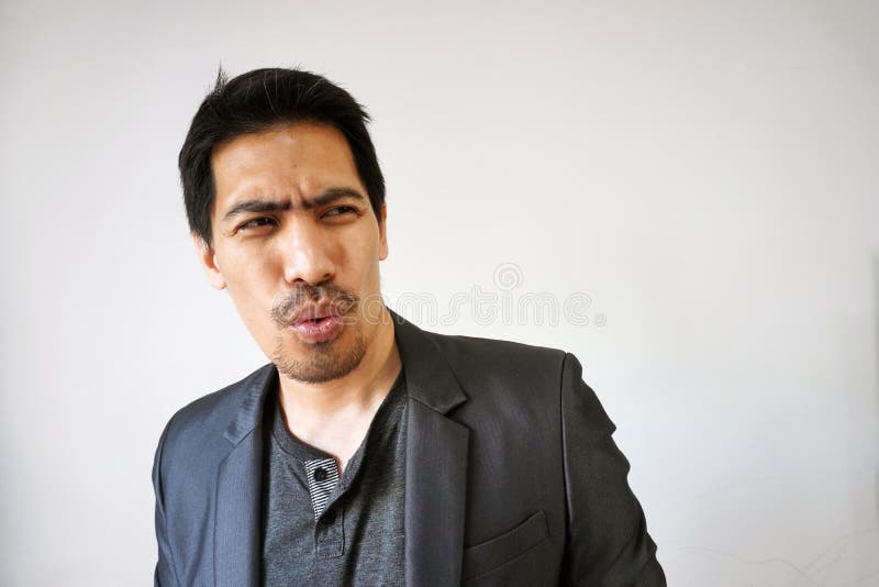 Portrait of Asian bearded businessman with a funny face stock photo Portrait of Asian bearded businessman with a funny face stock photo
