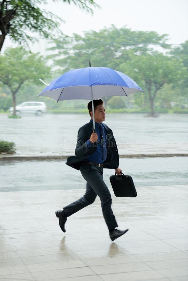 Asian Businessman Running Late royalty free stock photography Asian Businessman Running Late royalty free stock photography