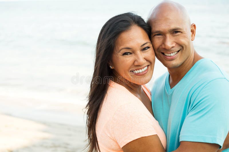 Couple on the beach smiling. royalty free stock photo Couple on the beach smiling. royalty free stock photo