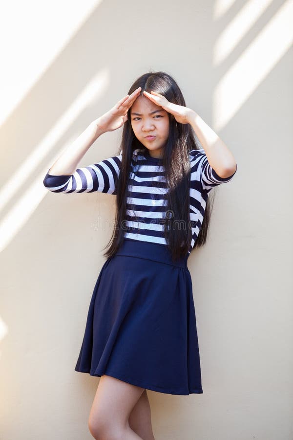 Portrait Of Asian Teen Age Smiling Face Standing At Home