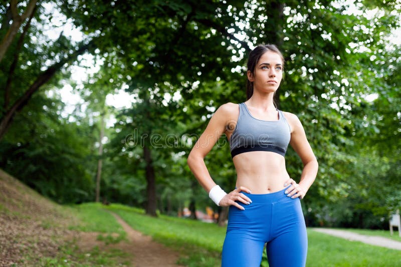 Portrait of Athletic Woman Resting after Running in Nature Stock Image ...