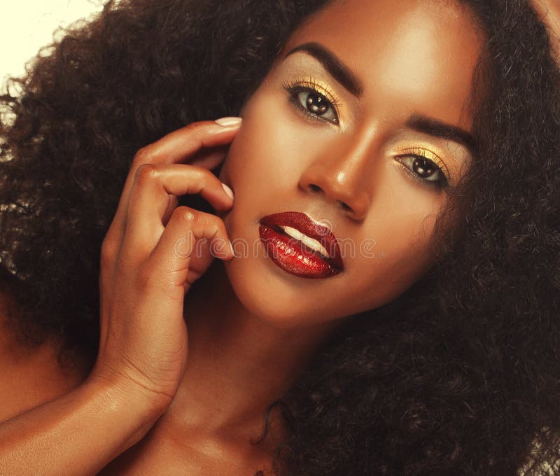 Beauty portrait of attractive african american woman with big afro and glamour makeup.