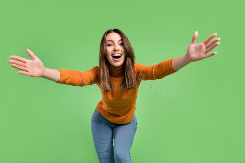 Portrait of attractive cheerful glad kind girl having fun dancing hugging you isolated over green color background