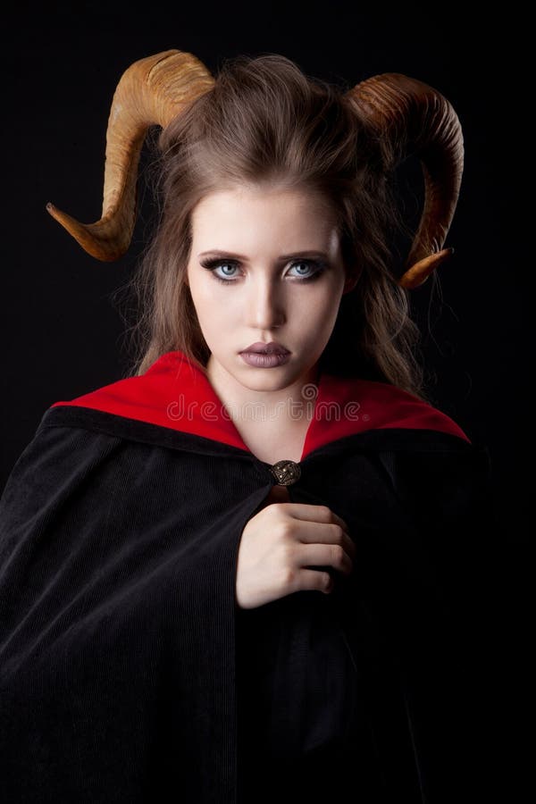 Devil woman with horn in a fire Stock Photo by ©fxquadro 110973372