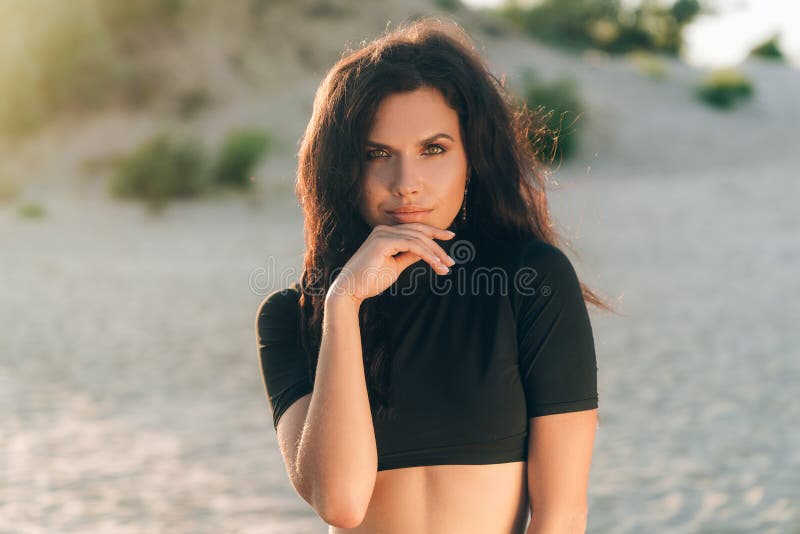 Portrait Of An Attractive European Woman Has Tanned Skin With Freckles From The Sun Posing On 