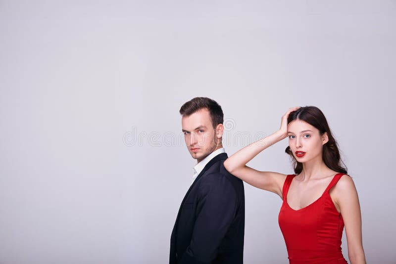 Formal Couple in Tuxedo and Blue Dress Pose for Photograph stock photo |  Creative Fabrica