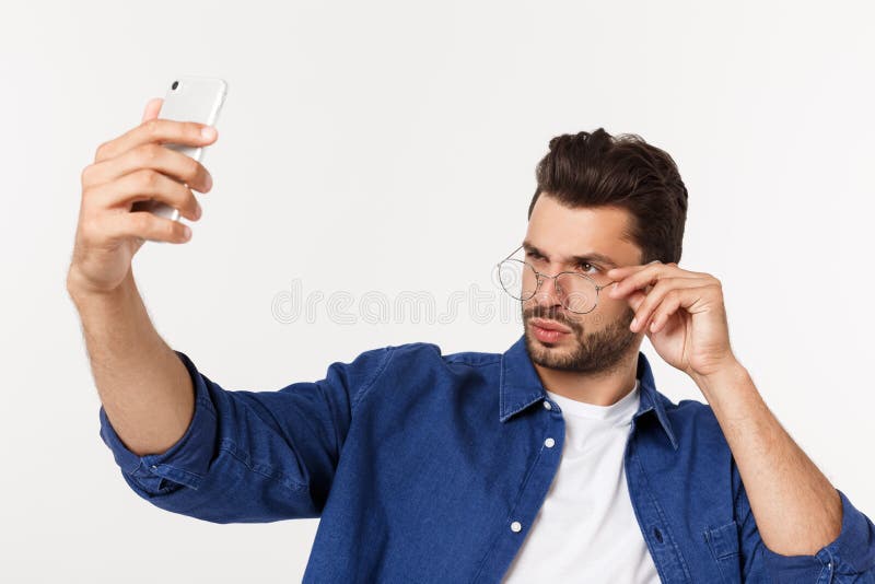 Portrait Of An Attractive Young Man Taking A Selfie While Standing And ...