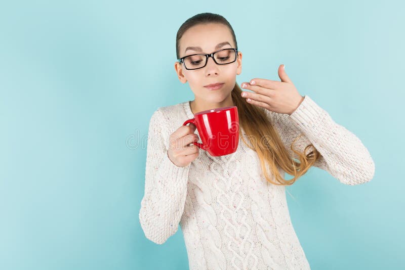 Attractive woman with ponytail and cup stock photo Attractive woman with ponytail and cup stock photo