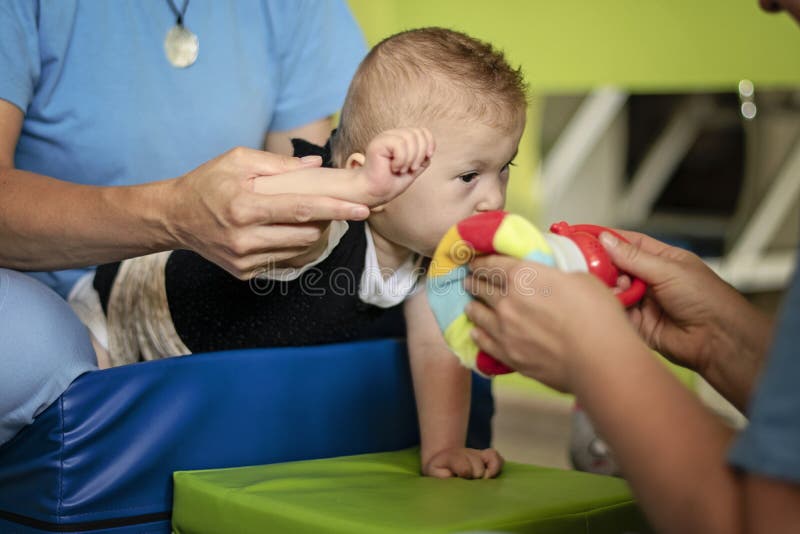 Portrait of a Baby with Cerebral Palsy on Physiotherapy Stock Image ...