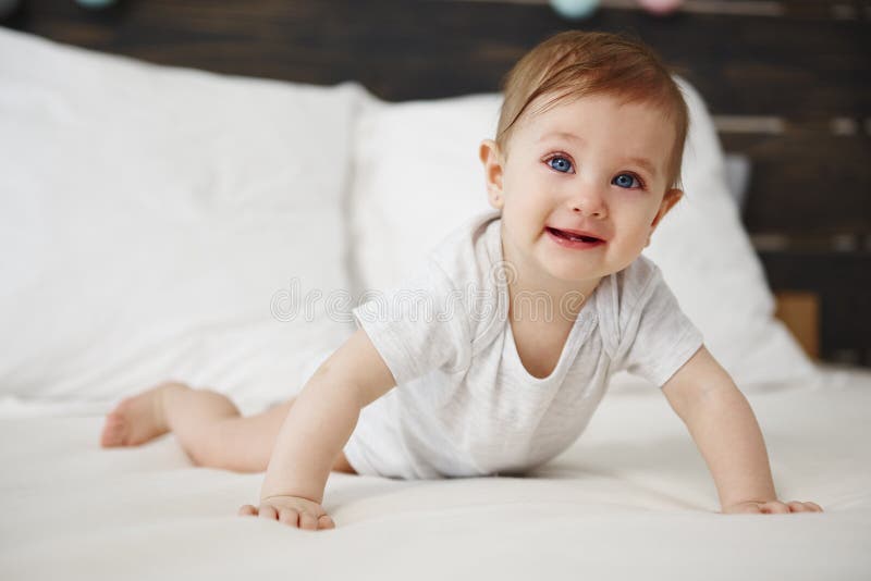 Portrait of Baby Crawling on the Bed Stock Image Image of close