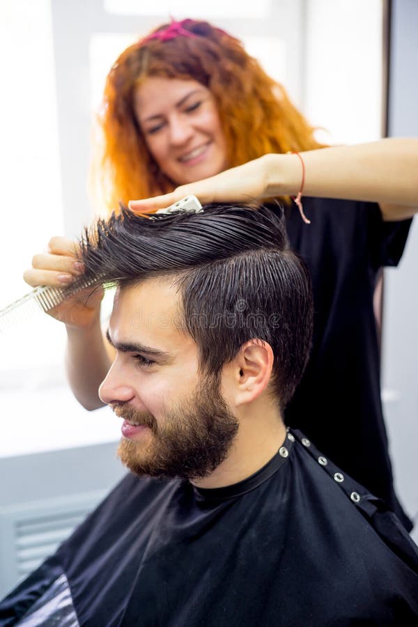 Barber dressing hair stock photo. Image of occupation 99136440