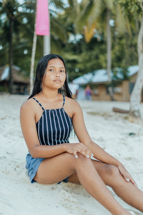 Portrait Of A Beauitful Brown Skin Filipina Model On A White Sand Beach