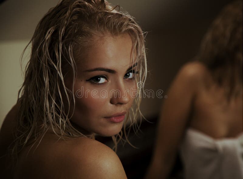Portrait of a beautiful attractive sexy and sensuality young adult pretty blonde woman after bath relaxing. Portrait of a beautiful attractive sexy and sensuality young adult pretty blonde woman after bath relaxing