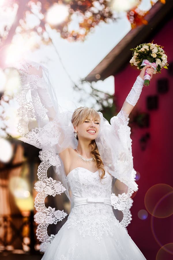Portrait of a beautiful blonde bride with wedding bouqet stock image Portrait of a beautiful blonde bride with wedding bouqet stock image