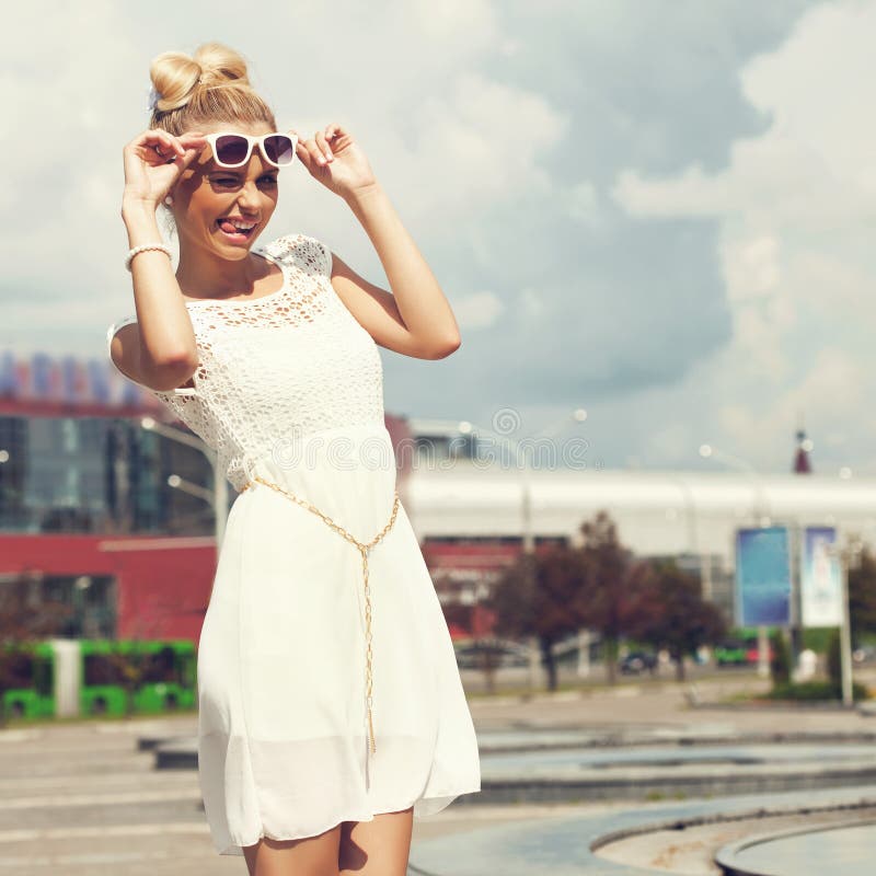 Portrait of Beautiful Blonde Girl in Sunglasses on Background Blue Sky ...