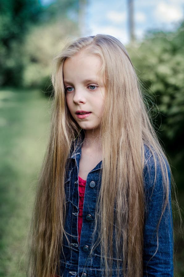 Portrait Of A Beautiful Blonde  Little Girl With Long Hair  