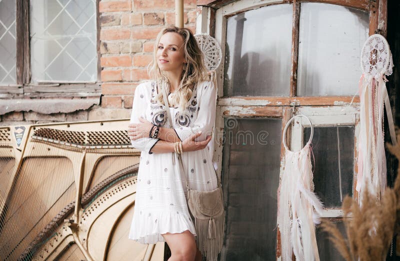 Portrait of beautiful blonde girl in boho style