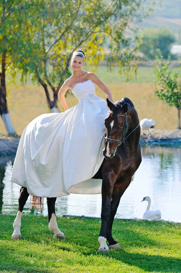 Portrait of beautiful bride with horse royalty free stock images