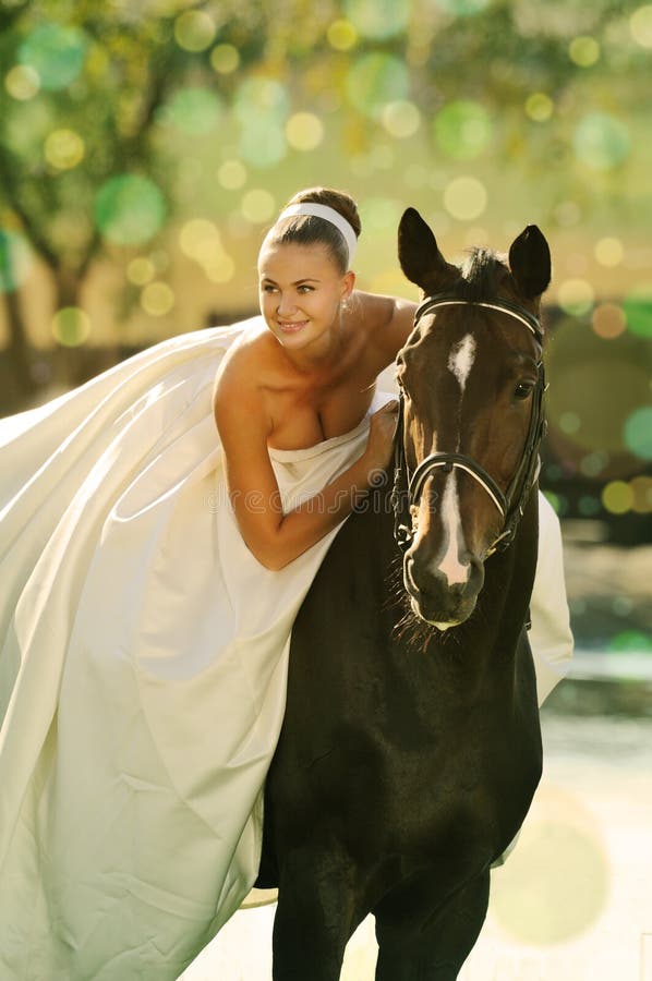 Portrait of beautiful bride with horse stock photos