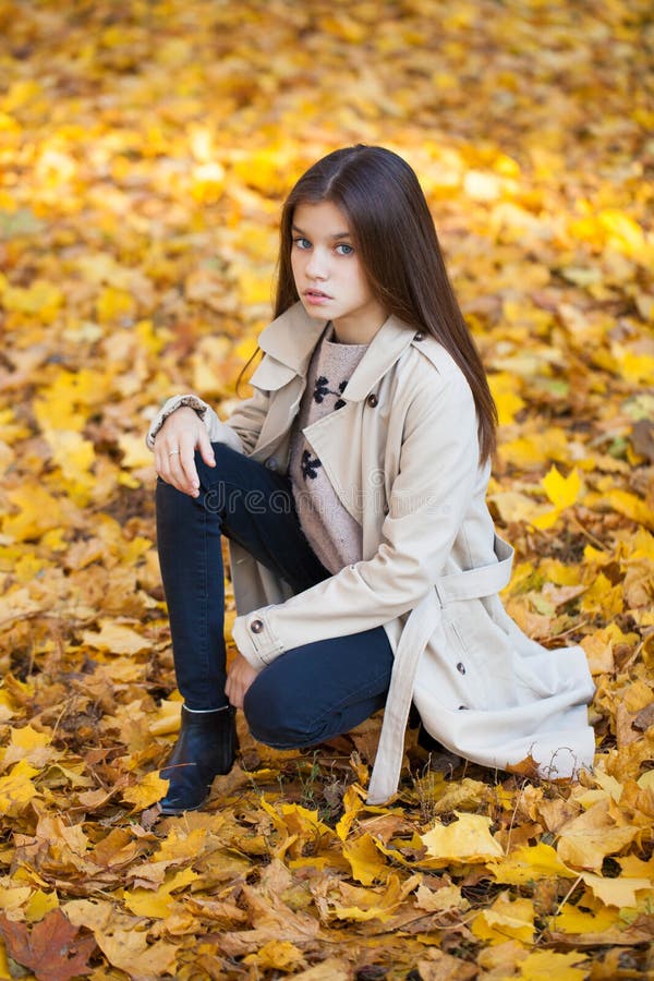 Portrait of a beautiful brunette little girl, autumn park outdoors stock photography Portrait of a beautiful brunette little girl, autumn park outdoors stock photography