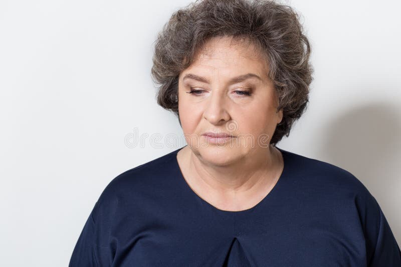 Portrait of beautiful elegant woman in a well-kept older srudii on a white background with makeup and without makeup