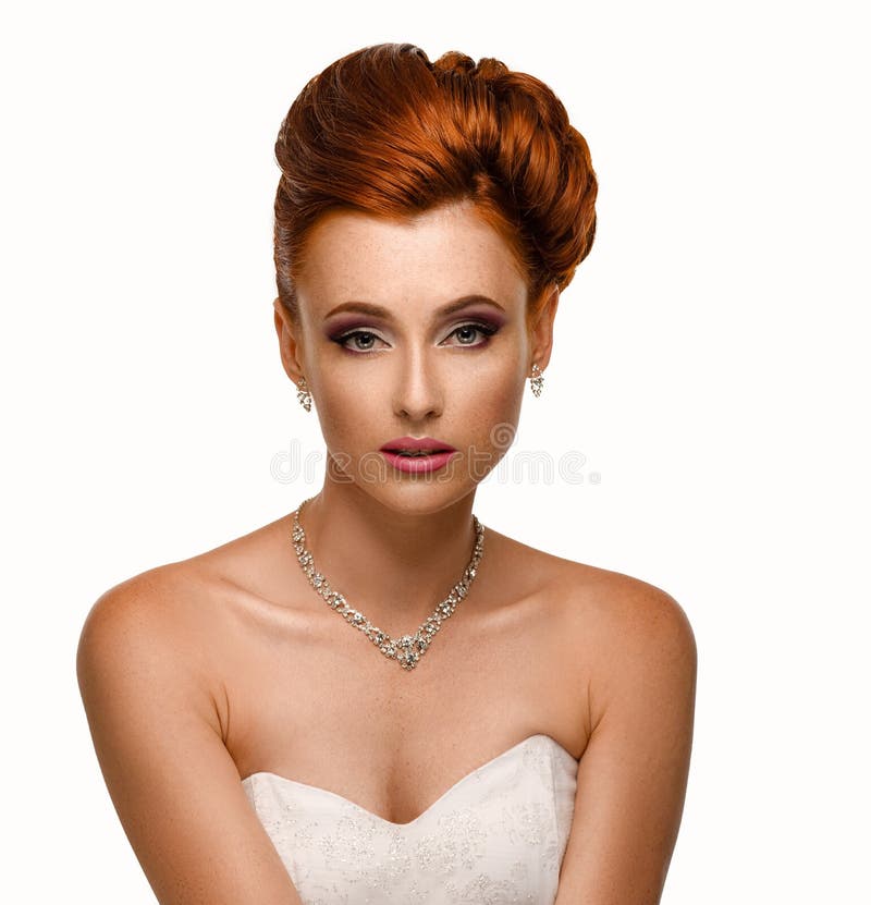 Portrait of a beautiful ginger woman in the image of the bride