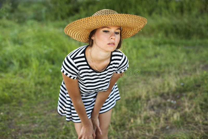 Portrait of beautiful girl in field