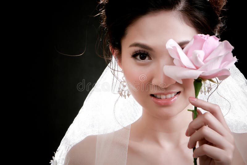 Portrait of beautiful girl with flower on her face