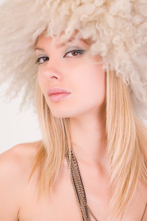 Portrait of beautiful girl in furry hat