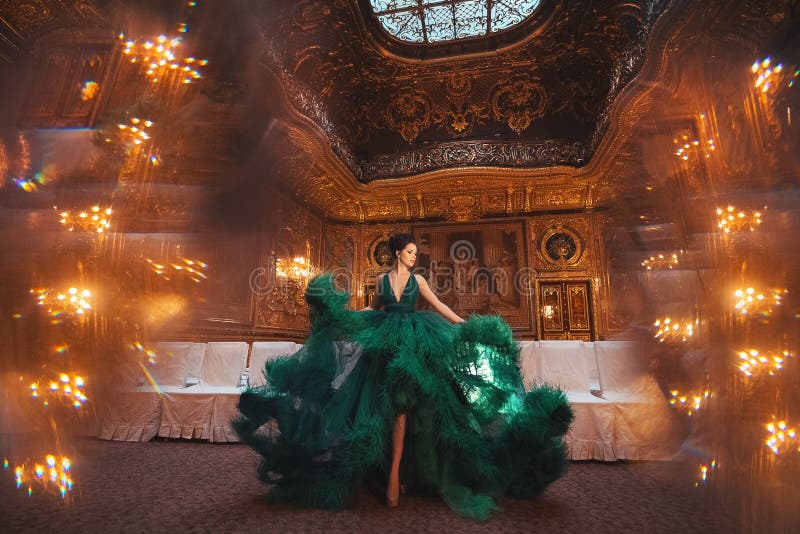 Portrait of a beautiful girl in a Haute couture green dress.