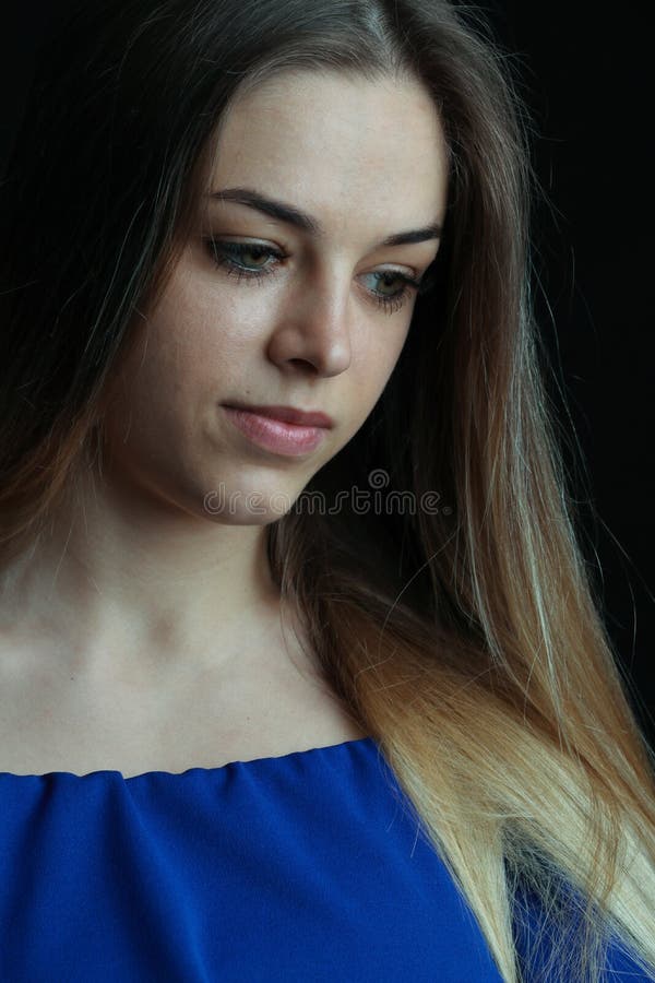 Portrait of a beautiful girl without retouching skin. Studio portrait on a black background. Closeup of attractive royalty free stock photo Portrait of a beautiful girl without retouching skin. Studio portrait on a black background. Closeup of attractive royalty free stock photo
