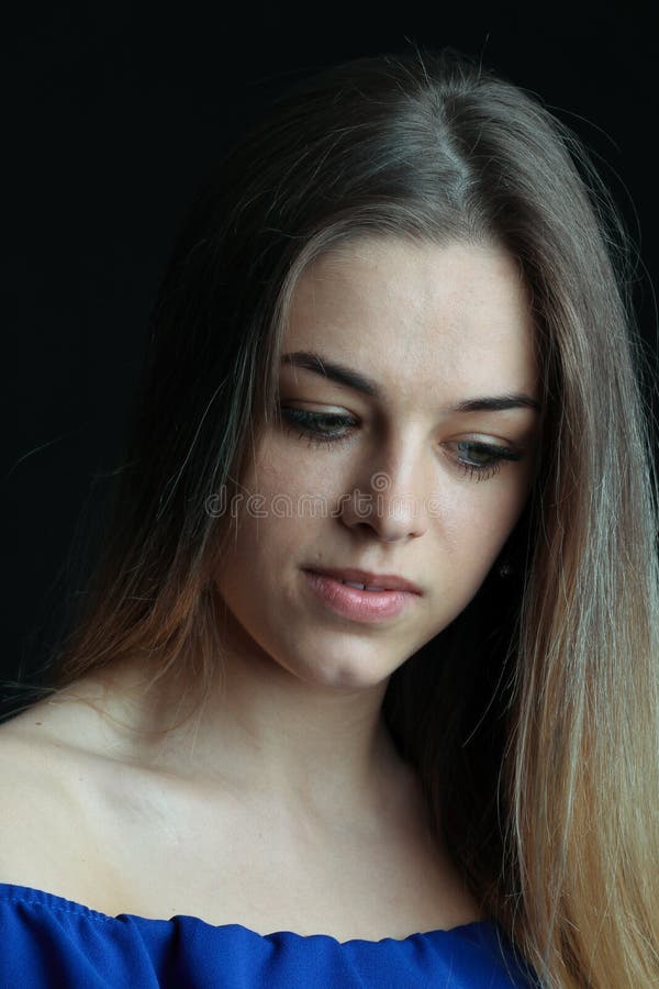 Portrait of a beautiful girl without retouching skin. Studio portrait on a black background. Closeup of attractive royalty free stock images Portrait of a beautiful girl without retouching skin. Studio portrait on a black background. Closeup of attractive royalty free stock images