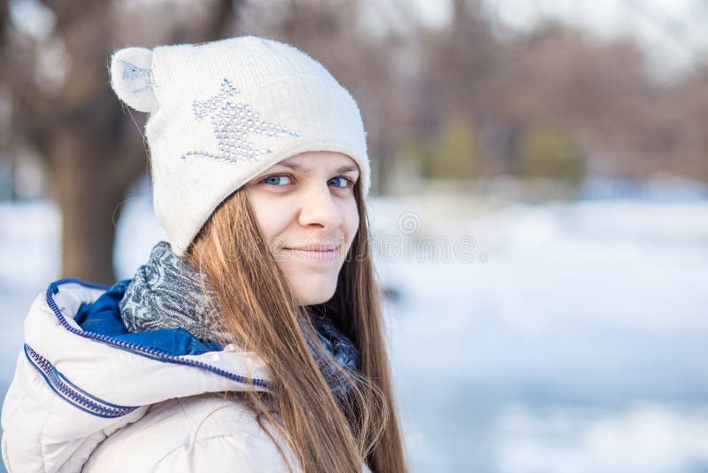 Portrait of a Beautiful Girl in White with Very Long Hair in a Snowy ...