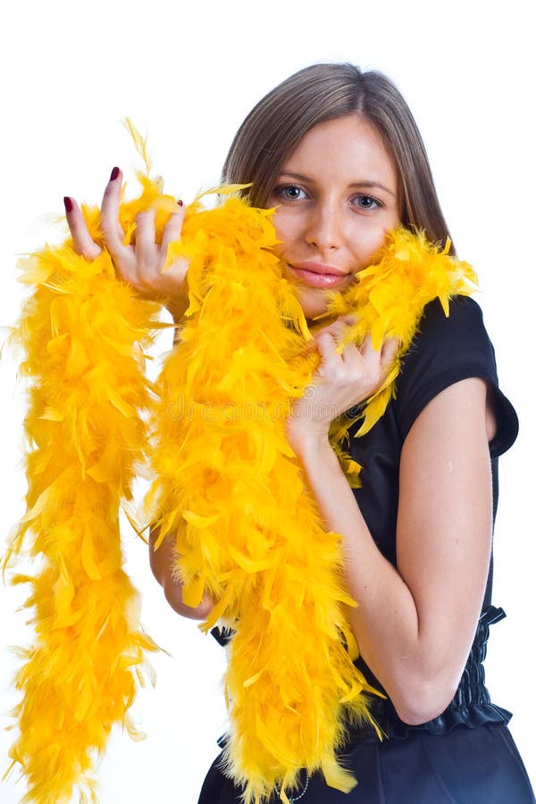 Portrait of the beautiful girl with yello feathers