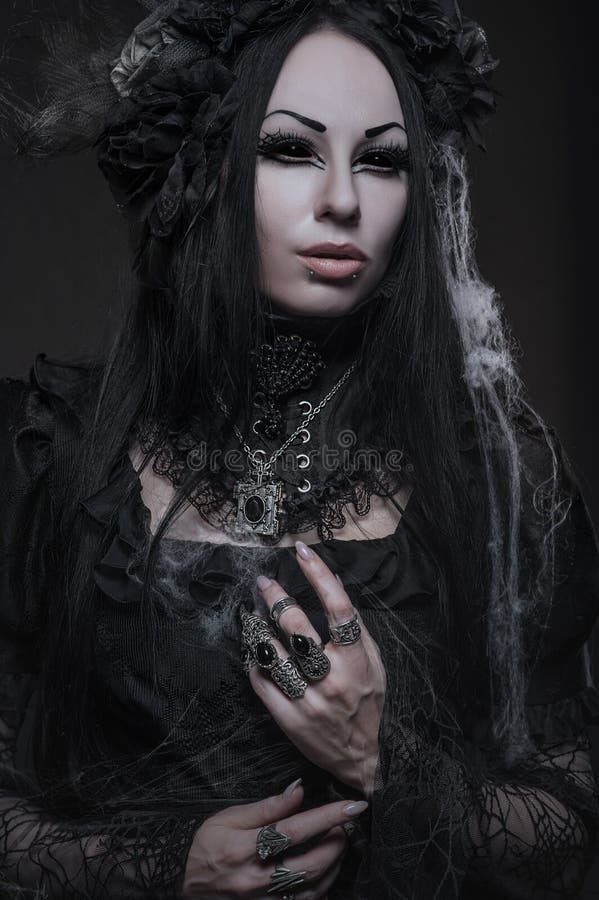 Portrait of beautiful Gothic woman in dark dress