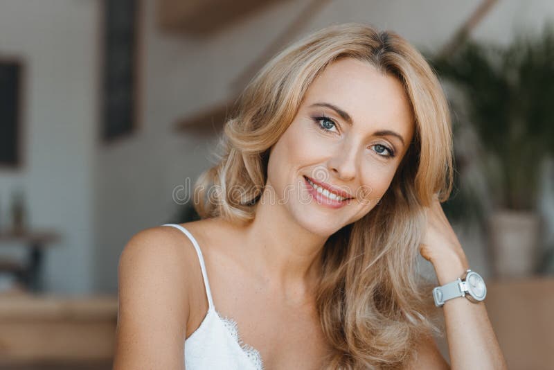 Active Beautiful Middleaged Woman Smiling Friendly And Looking Into The  Camera Woman39s Face Close Up Stock Photo - Download Image Now - iStock