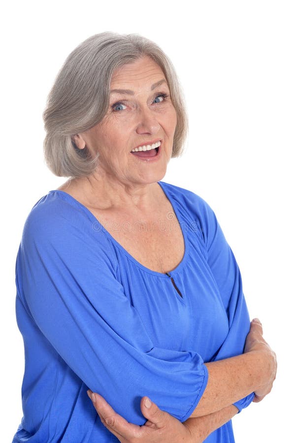 Portrait Of Beautiful Mature Woman In Blue Blouse Posing Against